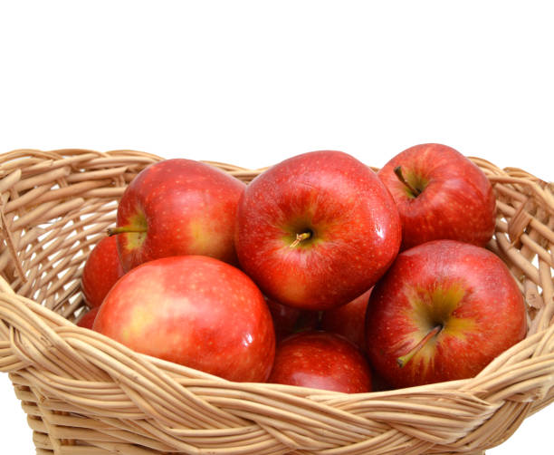 istock fresh apples in a basket on a white background 1050793576