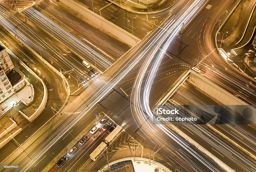 Road junction at evening Traffic & Building Forked Road Stock Photo