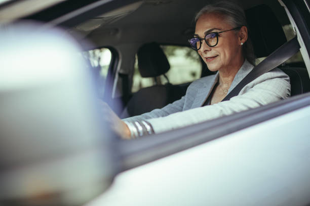 istock Senior female entrepreneur driving to office 1050803524