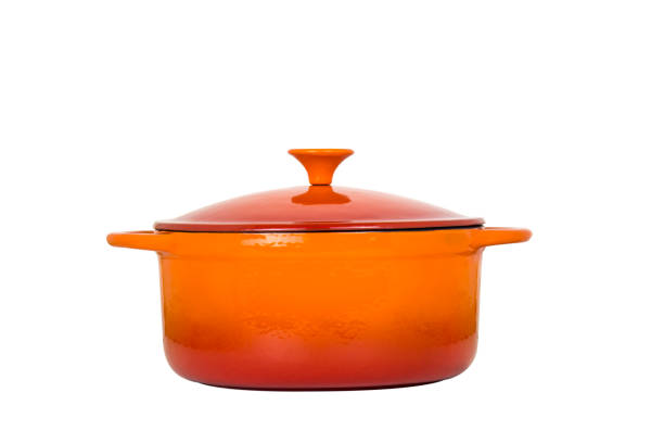 istock Orange cast iron pan with lid on white background. 1050809834