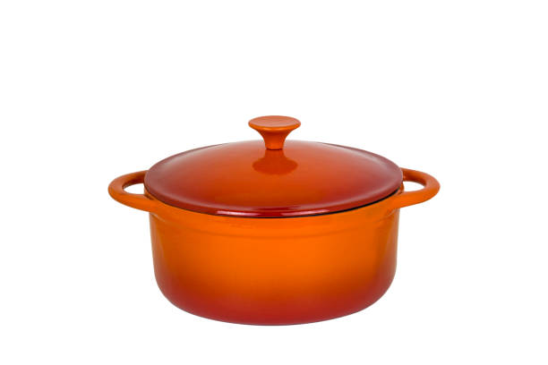 istock Orange cast iron pan with lid on white background. 1050809900
