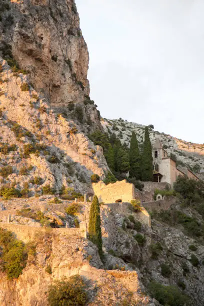 Photo of Moustiers-Sainte-Marie and sunset.