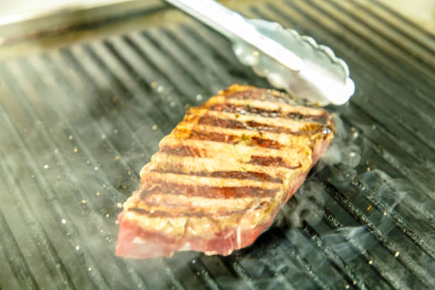 istock Marbled beef steaks grilled with pepper and bread 1050817834