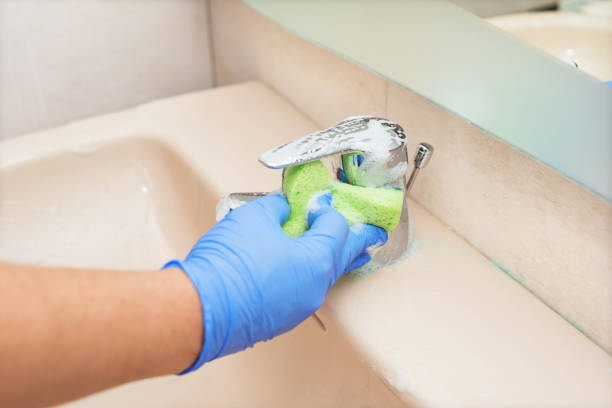 istock Man cleaning the bathroom sink 1050820424