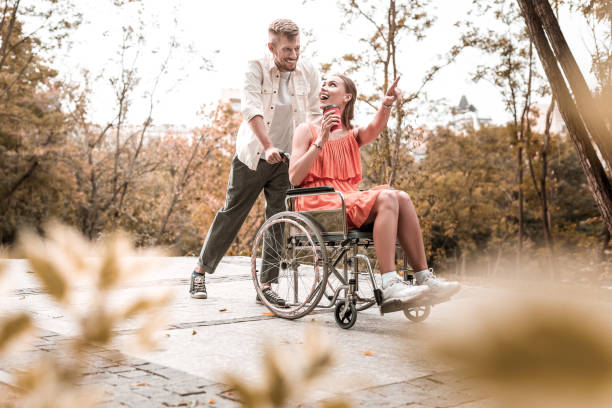istock Excited invalid pointing to the distance and looking happy 1050821090