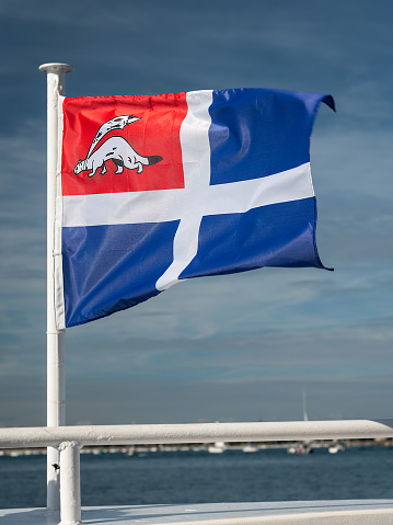 Flag of the city of Saint Malo (France) on a windy, sunny day in summer