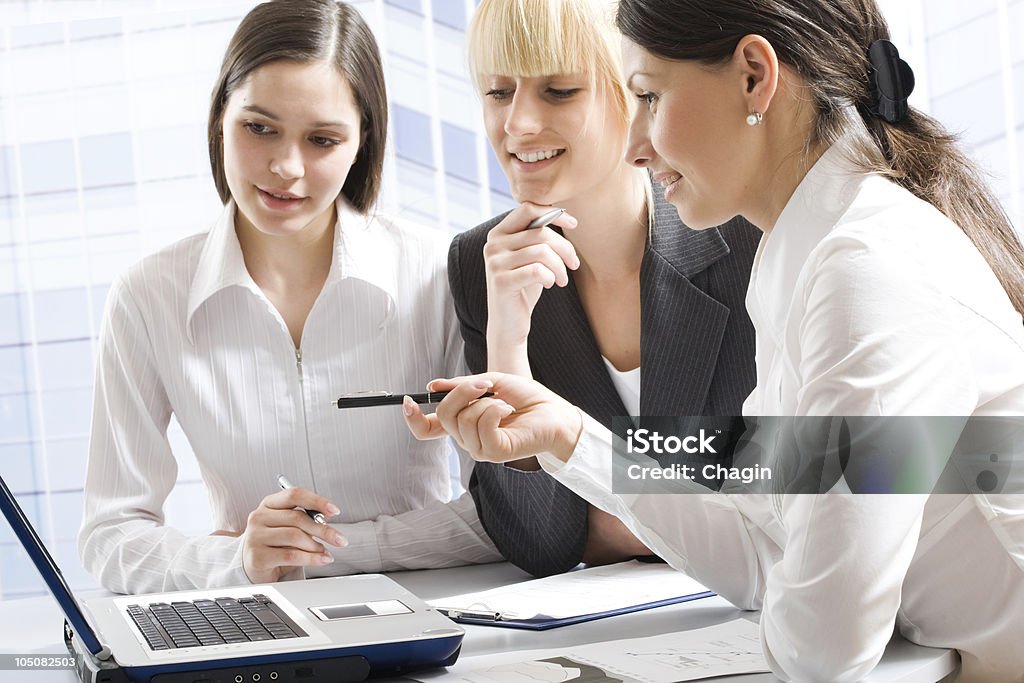 Three professionals Business women discussing in a meeting Adult Stock Photo