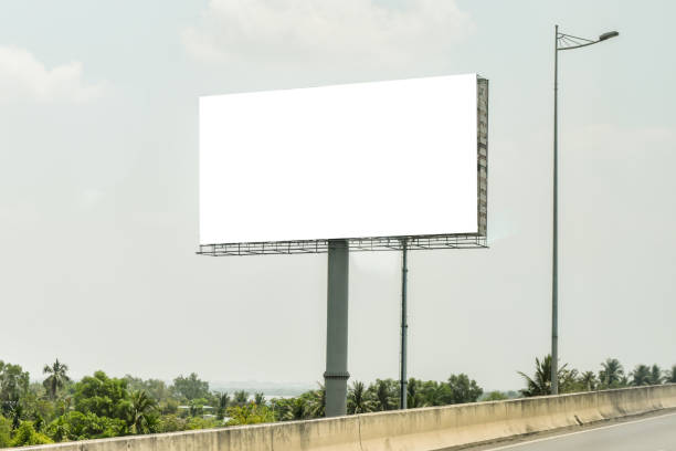 istock Blank billboard on blue sky background for new advertisement 1050830754