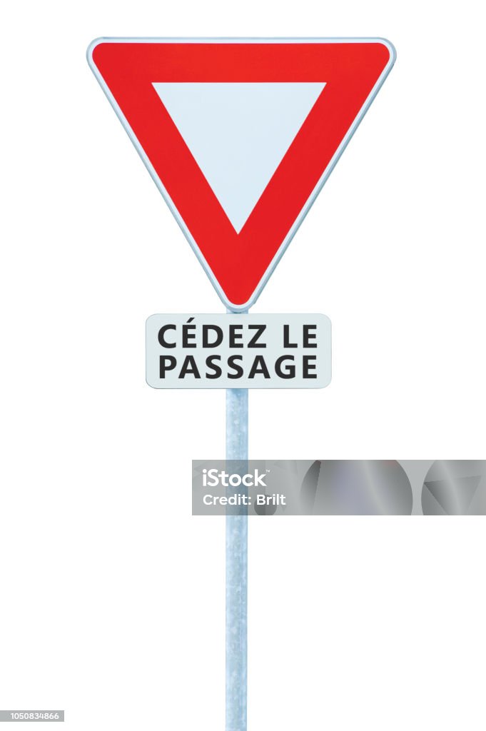 Give way yield french cédez le passage road sign, France, isolated vertical macro closeup, white signage triangle red frame regulatory warning, metallic pole post, panneau signalisation cédez-le-passage, large vehicle traffic priority roadsign signpost c Give way yield french cédez le passage road sign, France, isolated vertical macro closeup, white signage triangle red frame regulatory warning, metallic pole post, panneau signalisation cédez-le-passage, large vehicle traffic priority roadsign signpost concept Alertness Stock Photo