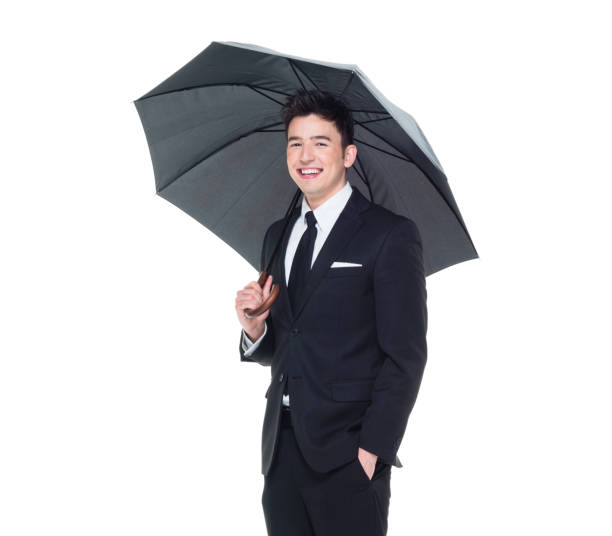 istock Handsome businessman holding an umbrella 1050838234