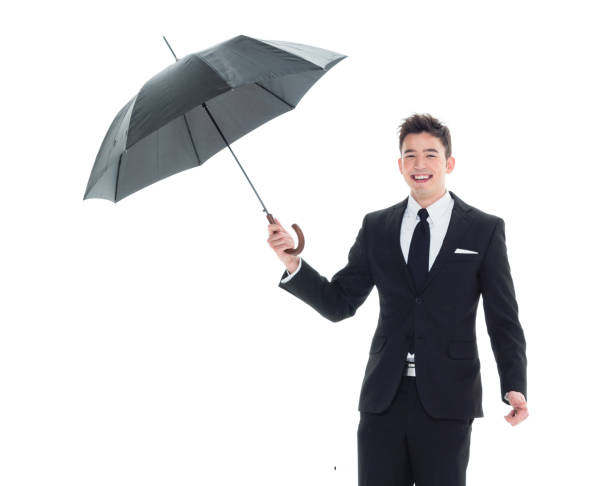 istock Handsome businessman holding an umbrella 1050838288