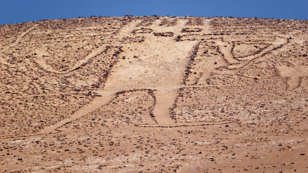 Giant of the Atacama, large petroglyph on a mountain in the Atacama desert, in the Tarapaca region of Chile. stock photo