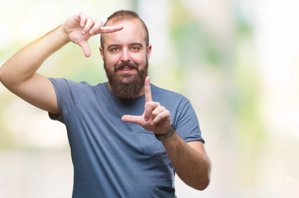 istock Young caucasian hipster man over isolated background smiling making frame with hands and fingers with happy face. Creativity and photography concept. 1050839068