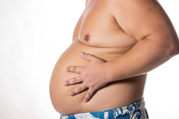 istock Fat man with big belly. Health problems 1050839528