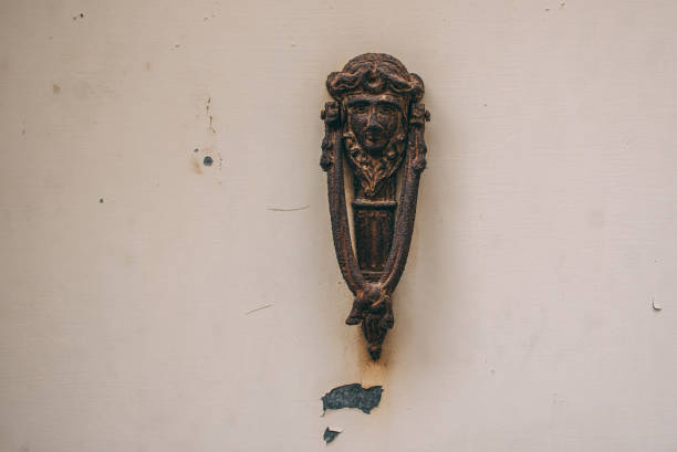 istock Old maltese door knocker, white background 1050842184