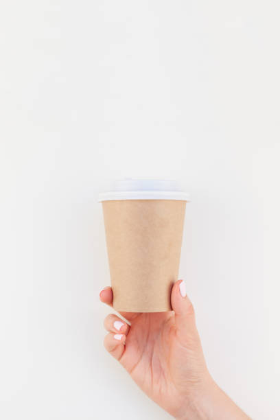 istock Mock up of coffee cup in female hand 1050843746
