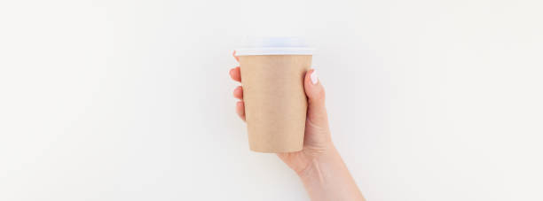 istock Mock up of coffee cup in female hand 1050843826