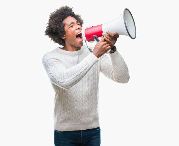 istock Young handsome afro american black man shouting through megaphone 1050846744