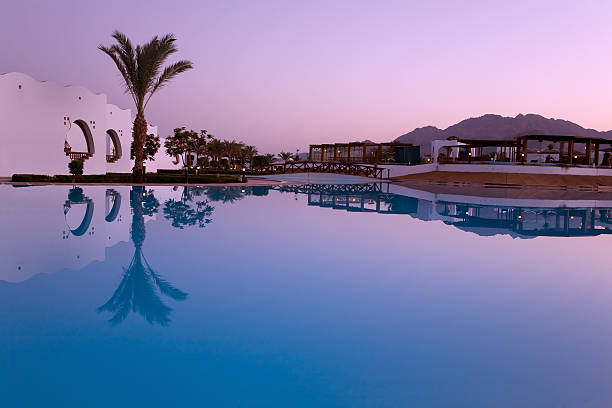 Evening reflection in swimming pool stock photo