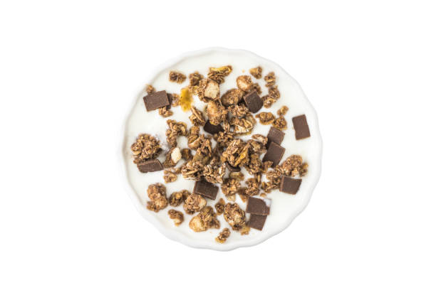 Bowl of Yogurt with Muesli and Chocolate Isolated on White Background, Top View