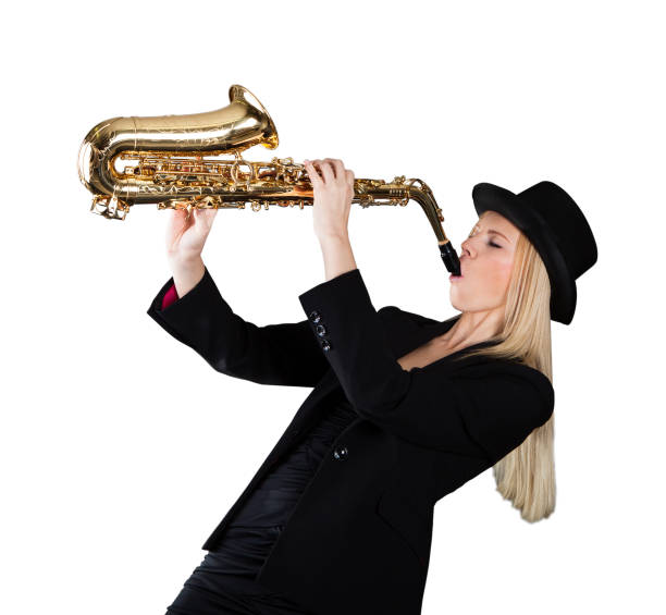 istock Beautiful young woman playing saxophone 1050851788