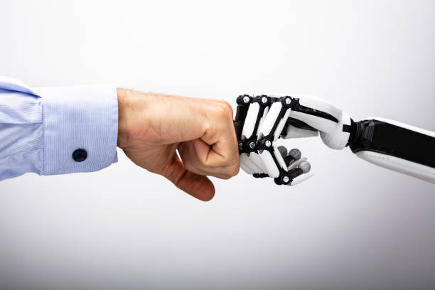 human hand and robot making fist bump - artificial intelligence imagens e fotografias de stock