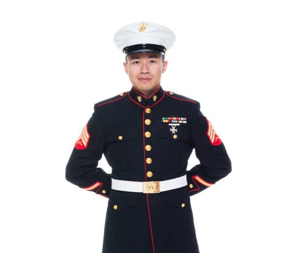 US Marine in uniform with arms behind