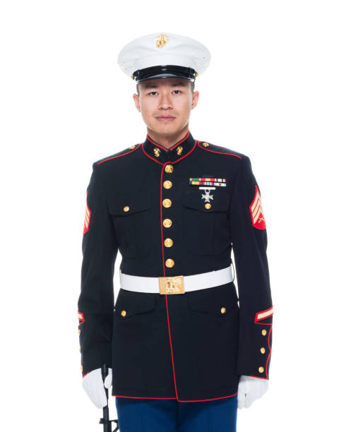 istock US Marine in uniform holding rifle 1050859076