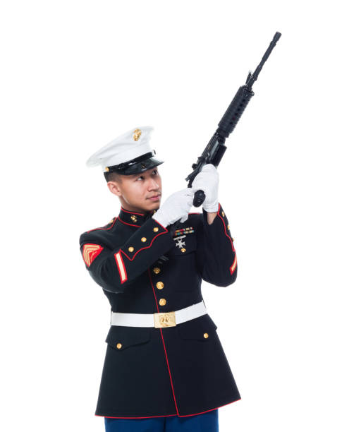 istock US Marine in uniform holding rifle 1050859080