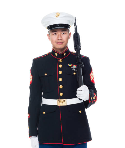 istock US Marine in uniform holding rifle 1050859082