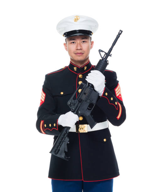 istock US Marine in uniform holding rifle 1050859084