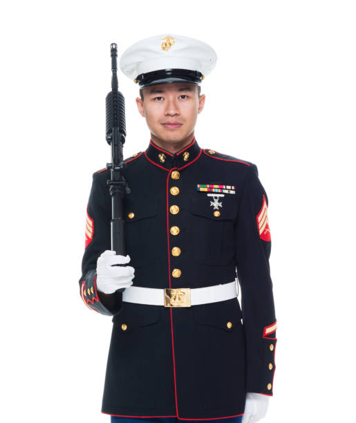 istock US Marine in uniform holding rifle 1050859088