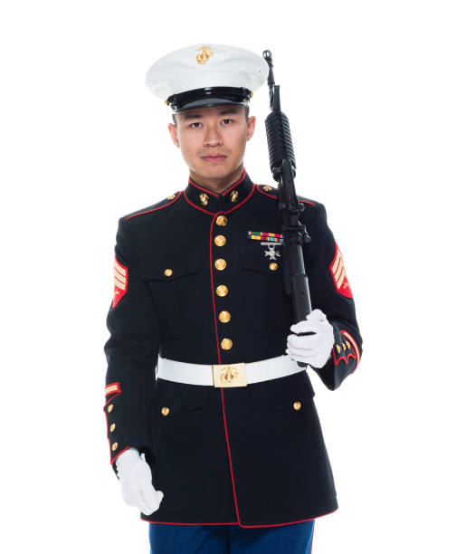 istock US Marine in uniform holding rifle 1050859104