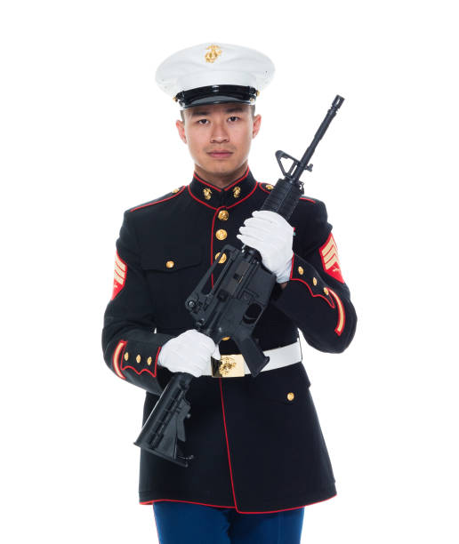 istock US Marine in uniform holding rifle 1050859110