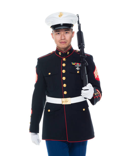 istock US Marine in uniform holding rifle 1050859122