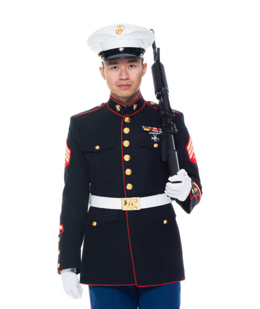 istock US Marine in uniform holding rifle 1050859128