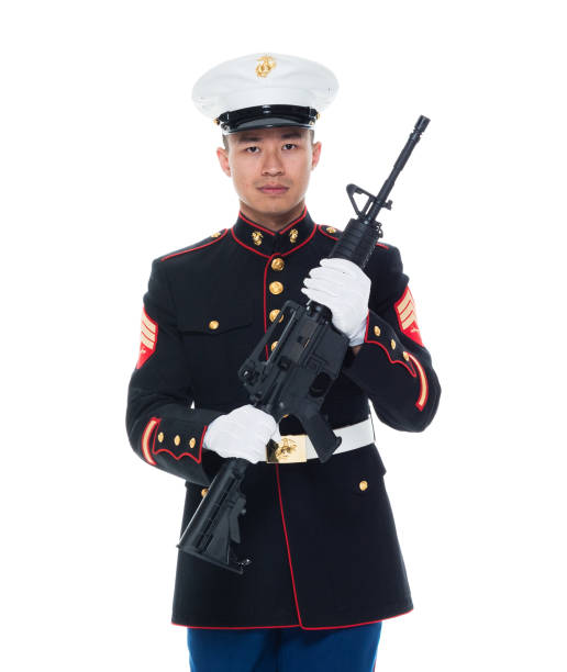 istock US Marine in uniform holding rifle 1050859132