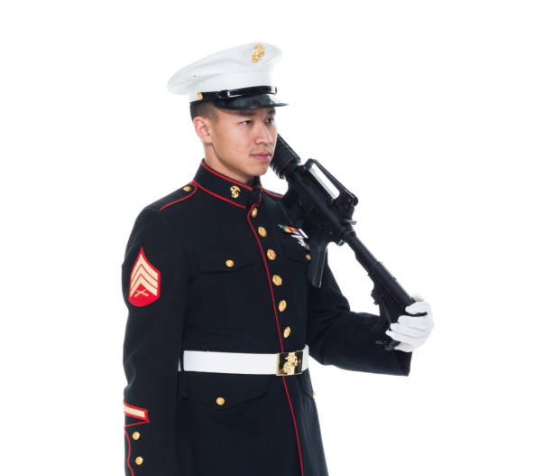 istock US Marine in uniform holding rifle 1050859144