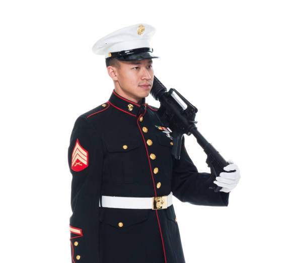istock US Marine in uniform holding rifle 1050859154