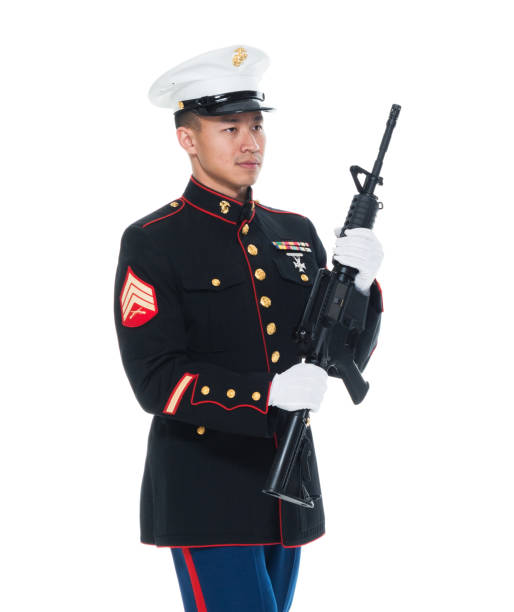 istock US Marine in uniform holding rifle 1050859170