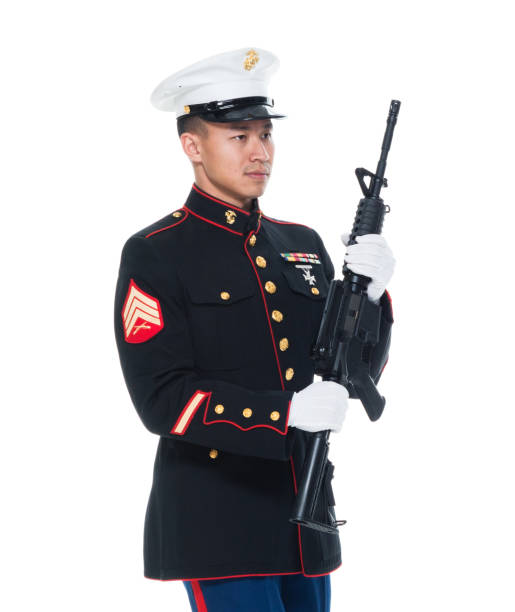 istock US Marine in uniform holding rifle 1050859180