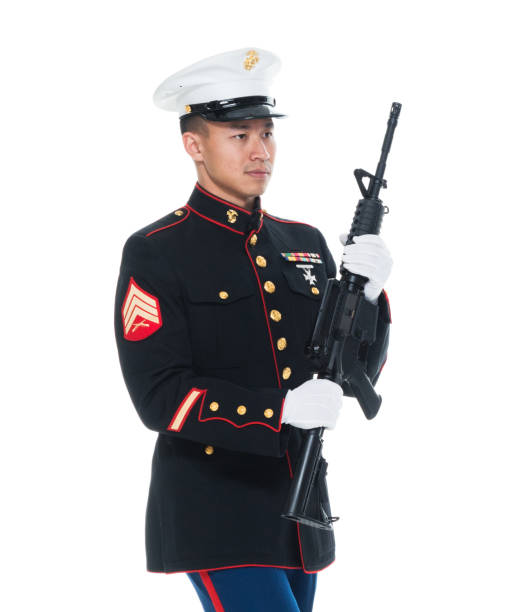 istock US Marine in uniform holding rifle 1050859182
