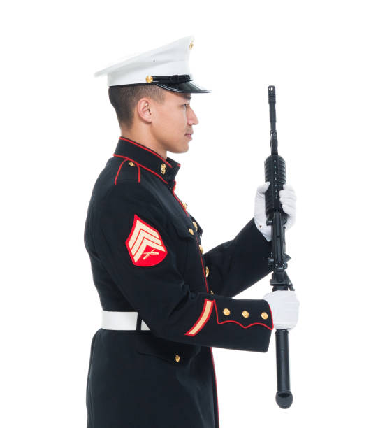 istock US Marine in uniform holding rifle 1050859218