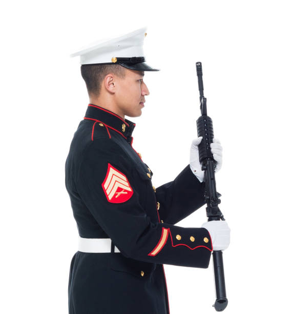istock US Marine in uniform holding rifle 1050859222