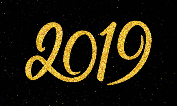 istock Happy New Year 2019 greeting card design template with gold text on black background. Calligraphy for chinese year of the pig. Vector illustration 1050859354