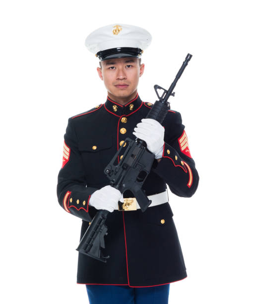 istock US Marine in uniform holding rifle 1050859844