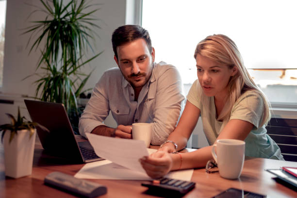 istock Unhappy couple having financial problems 1050860484