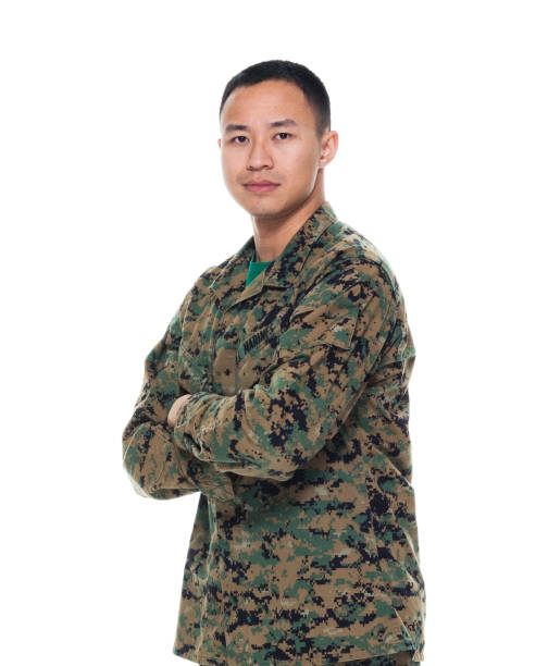 istock US Marine in uniform with arms crossed 1050863304