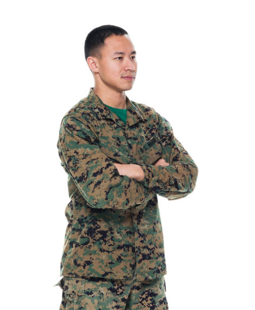 istock US Marine in uniform with arms crossed 1050863310