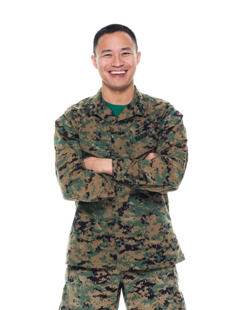 istock US Marine in uniform with arms crossed 1050863372